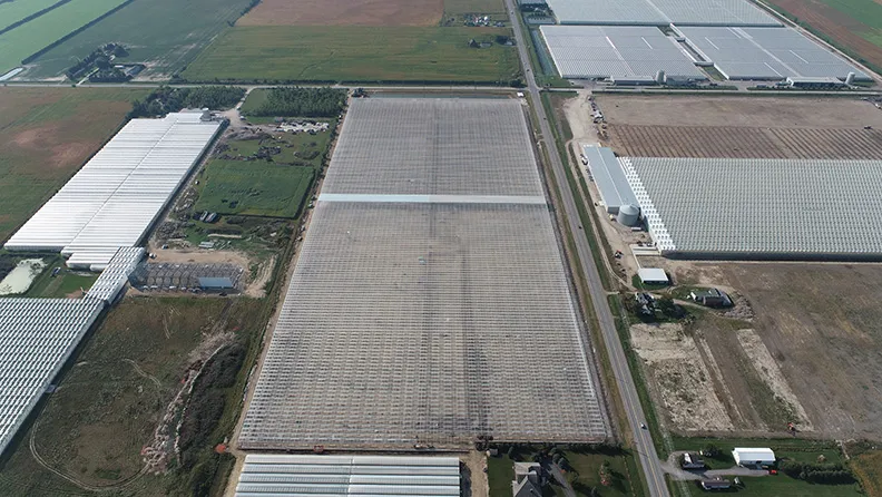 Aerial view of the greenhouses and surrounding farmland